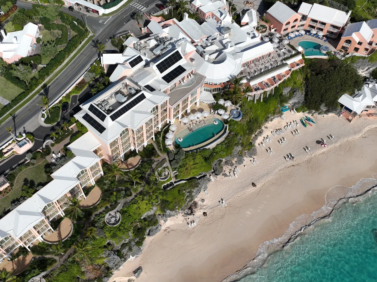 The Reefs resort on the beach in Southampton, Bermuda, with solar panels on its roofs, seen from the air