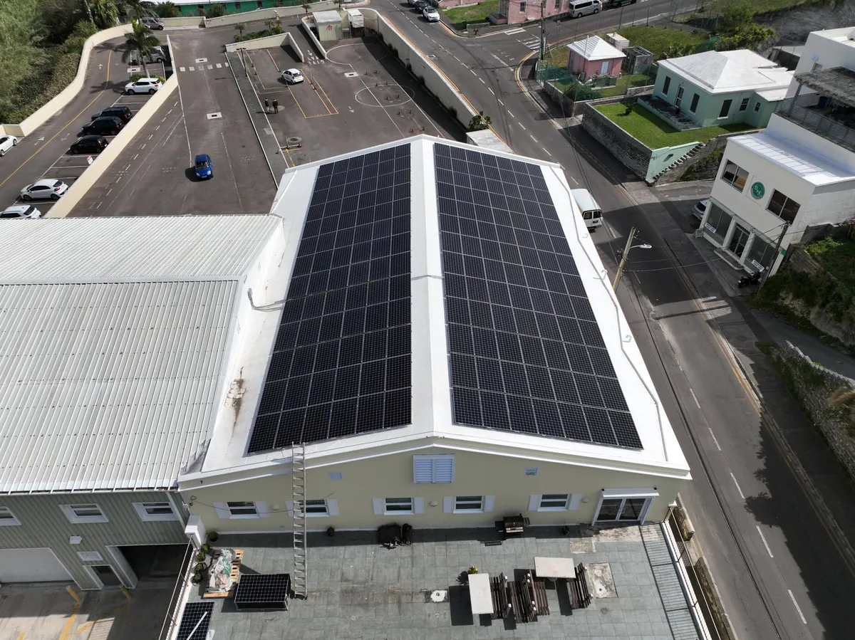 Solar panels covering both slopes of the Transport Control Department roof, Hamilton, seen from the air